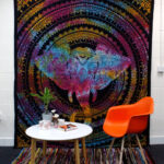 Elephant Head Double Bedspread and Wall Hanging displayed as Wall Art behind Table and chair