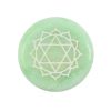 Heart chakra round green meditation stone close up