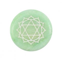 Heart chakra round green meditation stone close up