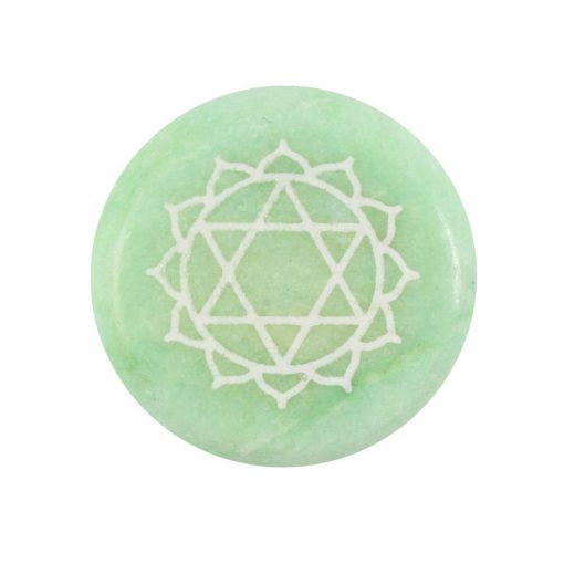 Heart chakra round green meditation stone close up