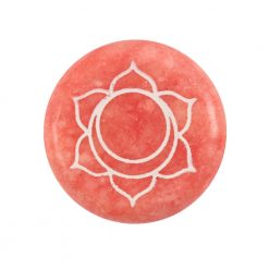 Sacral chakra round orange meditation stone close up