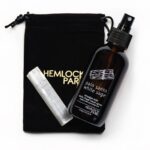 Hemlock park white sage and palo santo smudge spray 110ml shown with selenite crystal and black velvet storage pouch