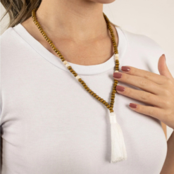 Lady wearing Grounding 108 bead mala as necklace